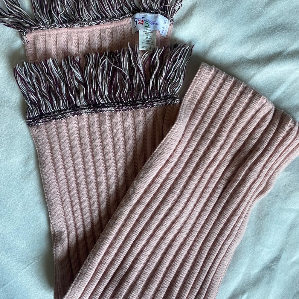 Cute light pink scarf.